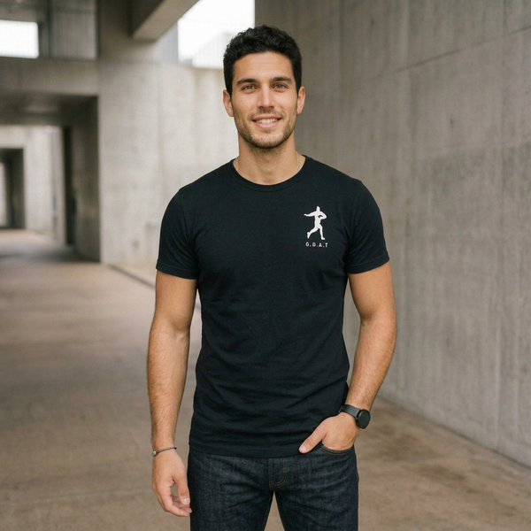 Model wearing the LOMU I'M A FREAK tee, front view with Fend G.O.A.T chest logo