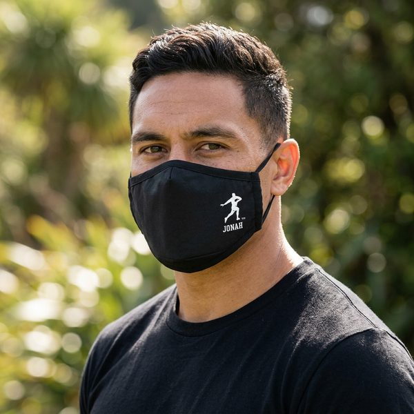 Olive-skinned male model wearing the black Jonah Fend face mask