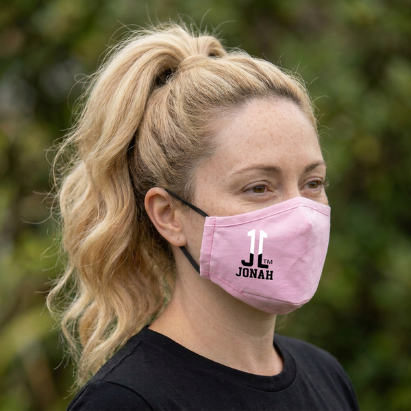 Woman turned to show the pink JL11 JONAH mask logo